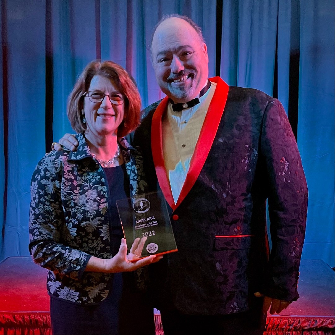 Lynn Pandiani accepts the award for CBCF's Benefactor of the Year from Executive Director Dominic Mantuano